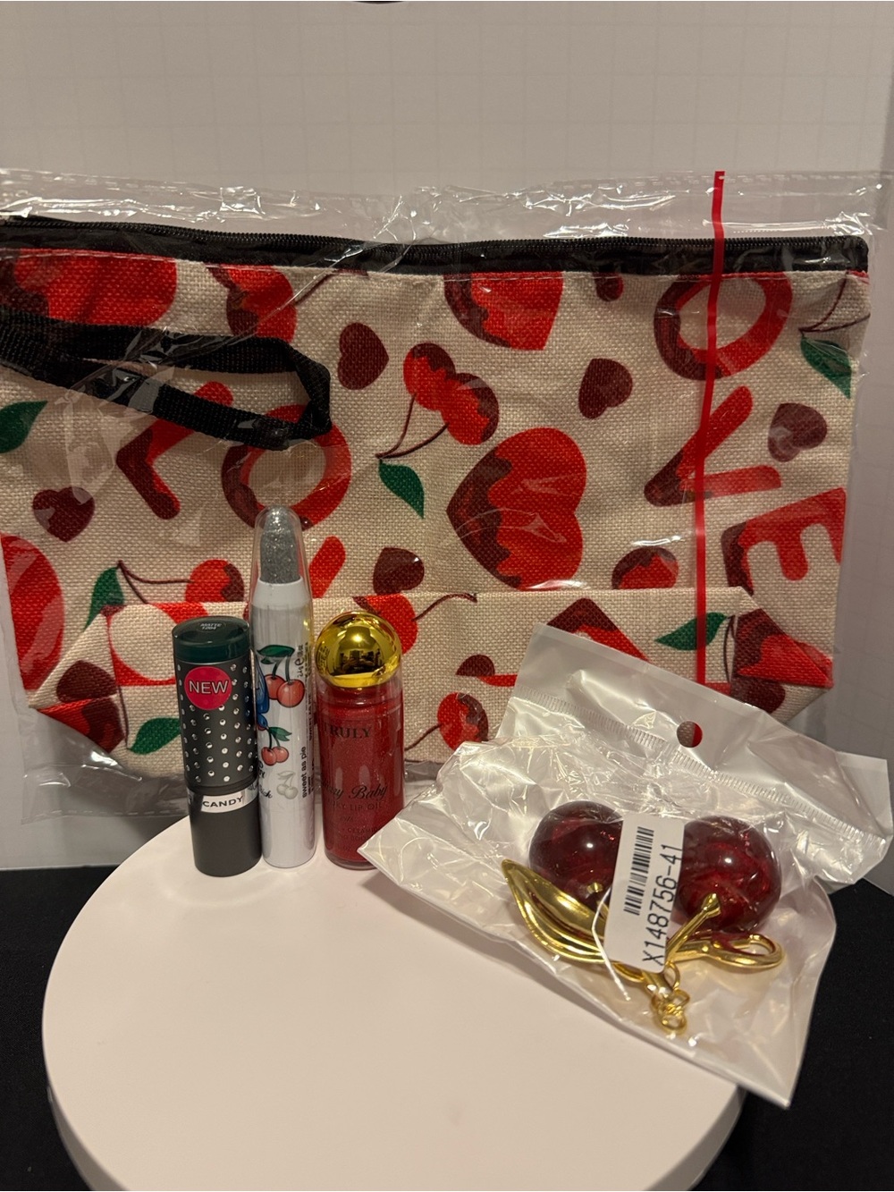 Cherry Print Cosmetic Bag with Cherry keychain and hard candy makeup, truly lip